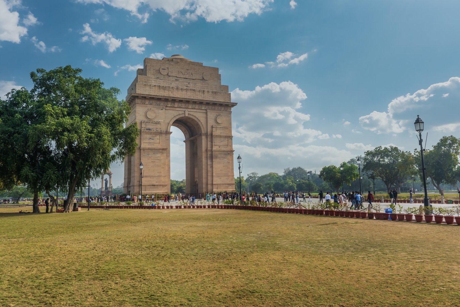 Gate of India, war memorial in Delhi with people and tourists
