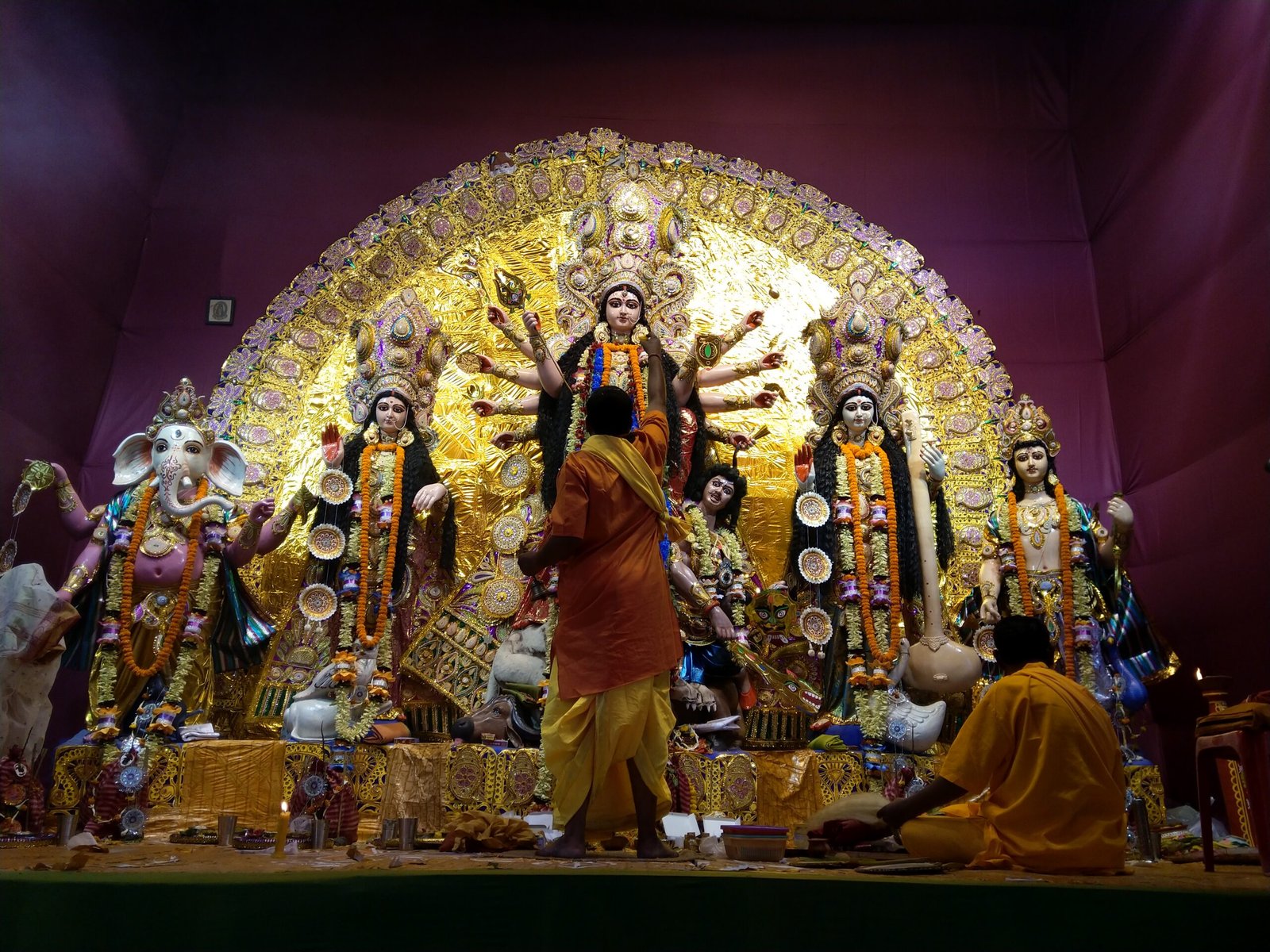 rear-view-priests-worshiping-goddess-durga-festival