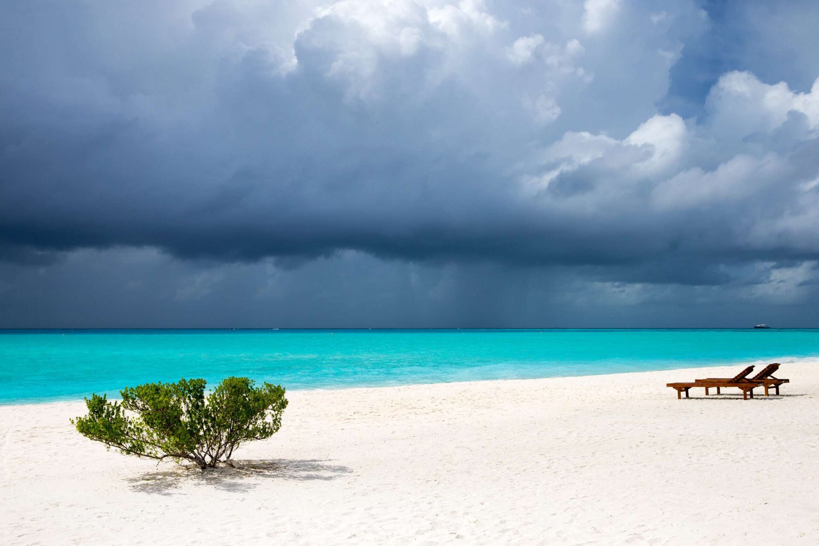 tropical Maldives island with white sandy beach and sea