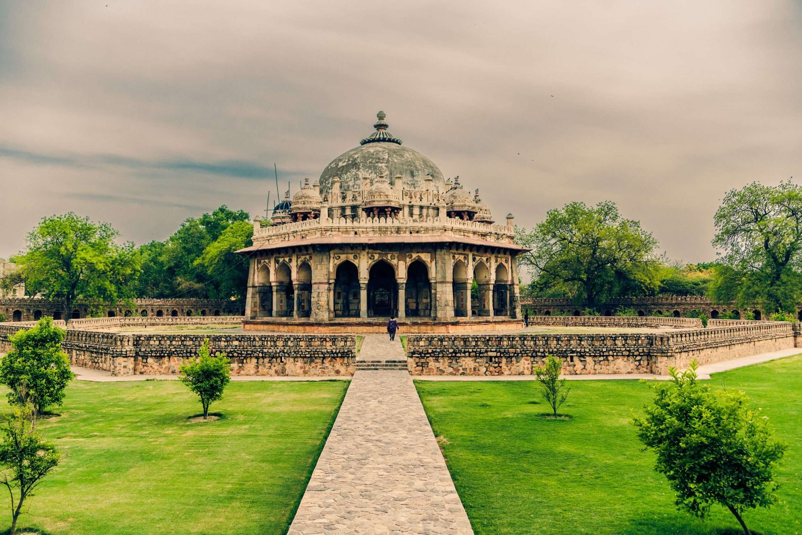 A beautiful shot of Isa Khan's Tomb in Delhi India under a cloudy sky